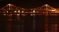River bridge traffic at night, shining reflections, ferry boats HD Footage