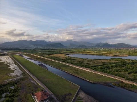 River Canal and Mountain Range Landscape in Karangasem Bali Stockfoto's