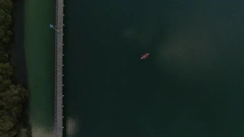 River with canoe 4k drone long shot Stock Footage 226916777
