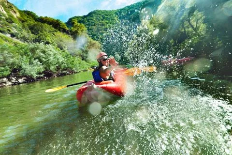 In river canoe splashes Stock Photos