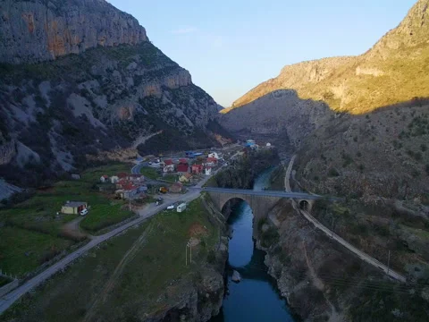 River in canyon between  mountains and the bridge 스톡 동영상 74683840