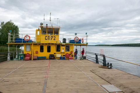 A river car ferry prepares for loading before departure Stock Photos