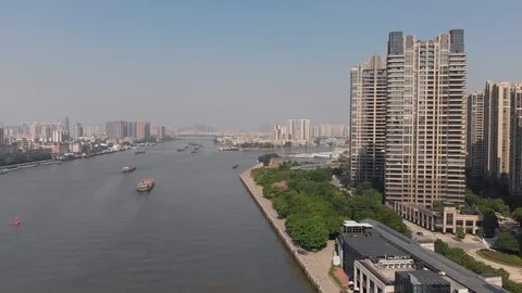 River with cargo ships. On the shore multi-storey residential buildings Video stock 118243522