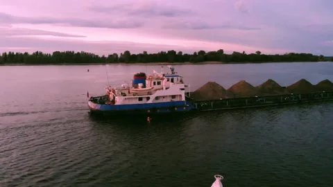A river cargo ship sails along the river Stock Footage 142073415
