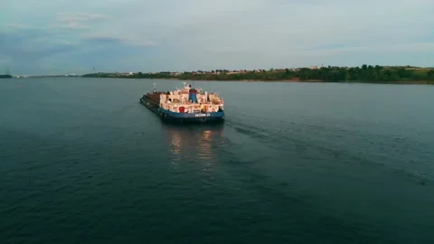 A river cargo ship sails along the river Stock Footage 142073469
