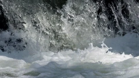 River cascade with a strong flow illuminated by dramatic sunlight Stock Footage 292933413