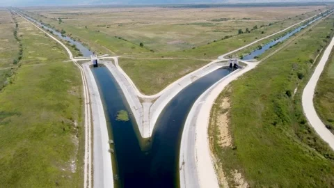 River channel in the field. Irrigation system, aerial drone view. Stock Footage 248902333