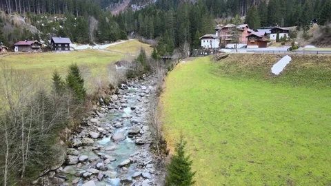 A river with clean water flowing through the alpine mountains Stock Footage 238475799