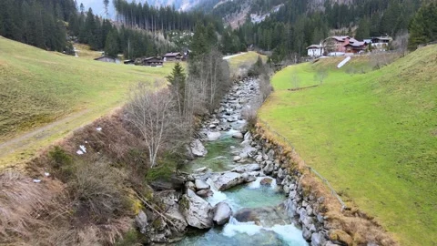 A river with clean water flowing through the alpine mountains Stock Footage 238477228