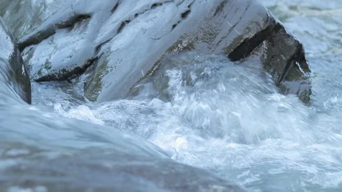 River with a clear stream, close-up, evening. Abundant clean flow Stock Footage 248772957