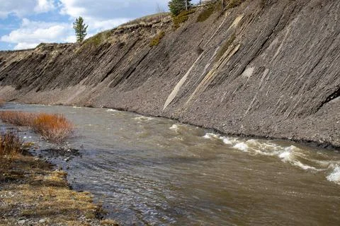 A River With A Cliff In The Background. Stock Photos