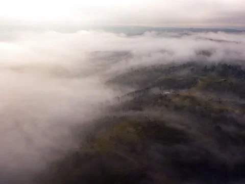River of clouds rolling throught hill scape/Aerial hyperlapse Stock Footage 231120384
