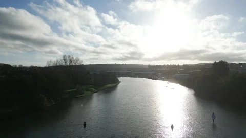 A river with a cloudy sky in the background Stock Footage 298274484