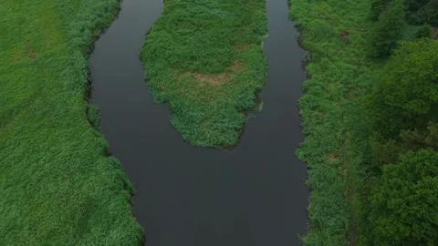 River Confluence – Low Backward Tilt Up Wide Aerial Reveal Over Watershed Video stock 336467459