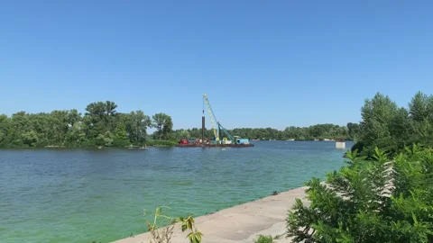 River construction site with crane on water platform Stock Footage 314135670