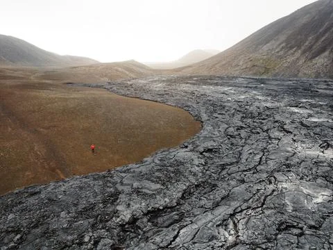 A river of cooled down lava turned into black volcanic rocks near Geldingadalir Stock Photos