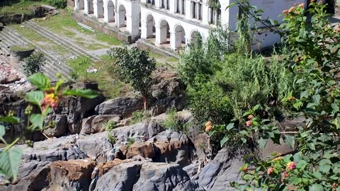 River coursing next to the Jal Binayak temple in Kirtipur, Nepal Stock Footage 219310238