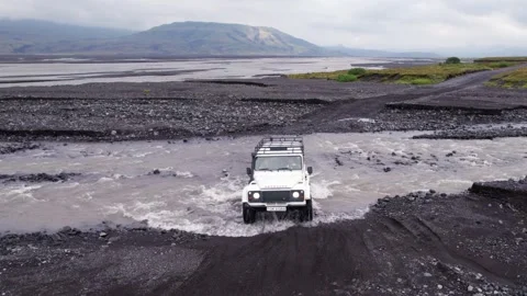 River Crossing 4x4 White Car Aerial View. Driving Through Dangerous Stock Footage 257051335