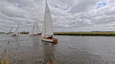 River Cruiser racing down the River Bure during the 2025 Acle Regatta Video stock 309833610