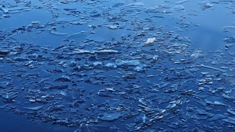 River current carries thin layer of melting ice, winter, early spring Stock-Footage 346376082