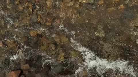 River Current Flowing Between Stones Viewed from Above Stock Footage 345504785
