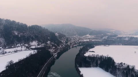 River cutting through snowy mountains Video stock 327448403
