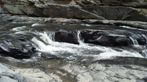 River cutting trough black rocks on the Brazilian Cerrado Stock Footage 297290577