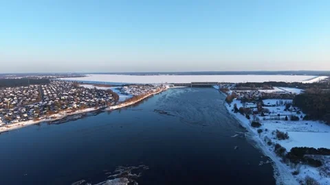 River Dam and Hydroelectric Facility in Snowy Terrain Stock Footage 328711856