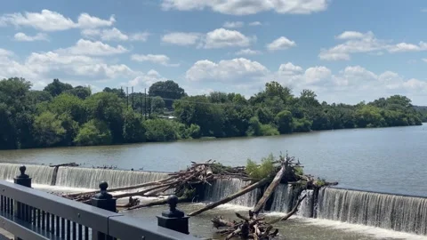 River Dam Overflow With Driftwood and Flowing Water Video stock 327853531
