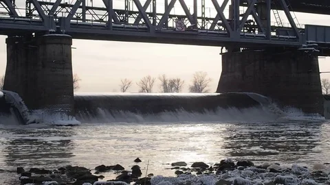 River, dam with winter scene in background. Stock Footage 82457045