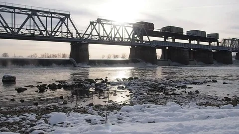 River, dam with winter scene in background. Stock Footage 82457156