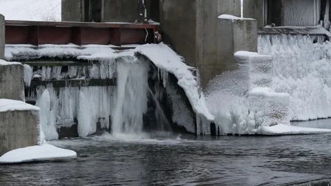 River, dam with winter scene in background. The turbulent water of the dam in th Stock Footage 84846484
