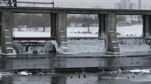River, dam with winter scene in background. The turbulent water of the dam in th Stock Footage 84847280