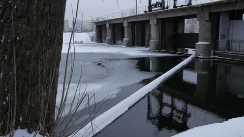 River, dam with winter scene in background. The turbulent water of the dam in th Stock Footage 84847334