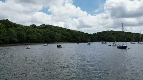River Dart, South Devon, England: DRONE VIEWS: Low angle, moored yachts &amp; boats Stock Footage 244522200