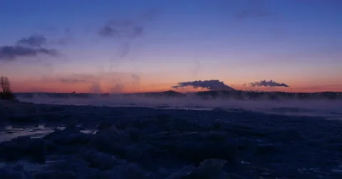 River at dawn in a very cold winter with chimney smoke in background. Stock Footage 61171520