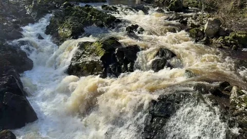 River Dee fast flowing due to high water level during the winter at the Bridge Stock Footage 270422360