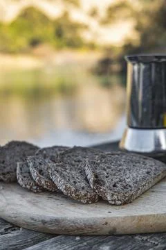 River of Delights: Breakfast with Bread and Coffee Aroma. Stock Photos