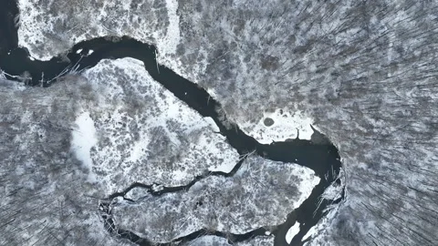 River delta floodplain winter snow meander drone aerial inland video shot in Stock Footage 227658355