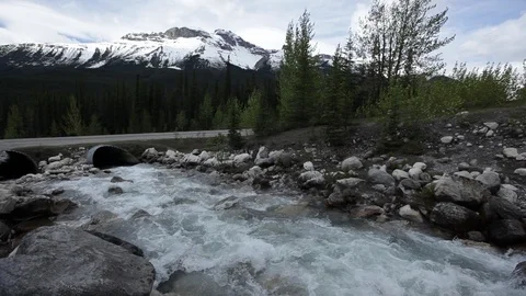 River diverted under a road in Alberta Stock Footage 90832808