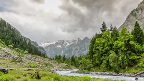 River down streaming in the mountains of a green valley Stock Footage 196872637