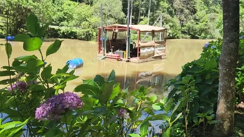 A river dredge-style machine Stock Footage 323416839