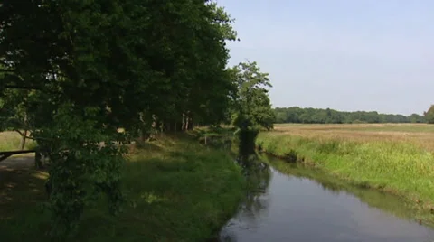 River Drentsche Aa flowing in countryside + pan valley Stock Footage 28651278