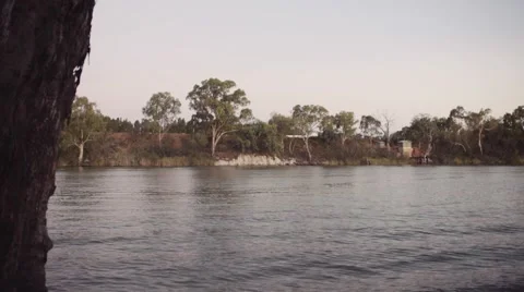 River at Dusk Panning through the grass Video stock 58887414