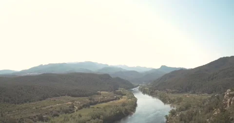 River Ebro as it passes through the town of Miravet in Catalonia Stock Footage 153598369