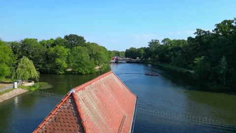River Elster weir, bridge in Leipzig summer. Majestic aerial view flight drone Stock Footage 283820906