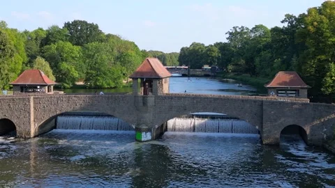 River Elster weir, bridge in Leipzig summer. Amazing aerial view flight drone Stock Footage 283820938