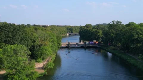 River Elster weir, bridge in Leipzig summer. Dramatic aerial view flight drone Video stock 283821016