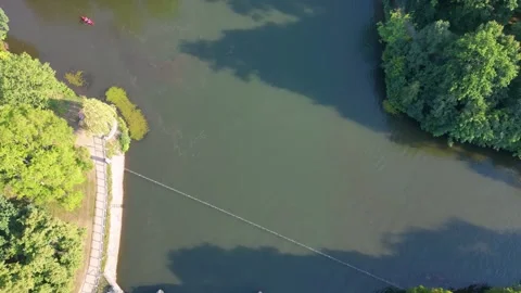 River Elster weir, bridge in Leipzig summer. Nice aerial view flight drone Stock Footage 283821052