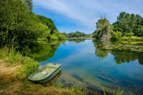 The River Eure, a tributary of the Seine, at the confluence of the two rivers Stock Photos